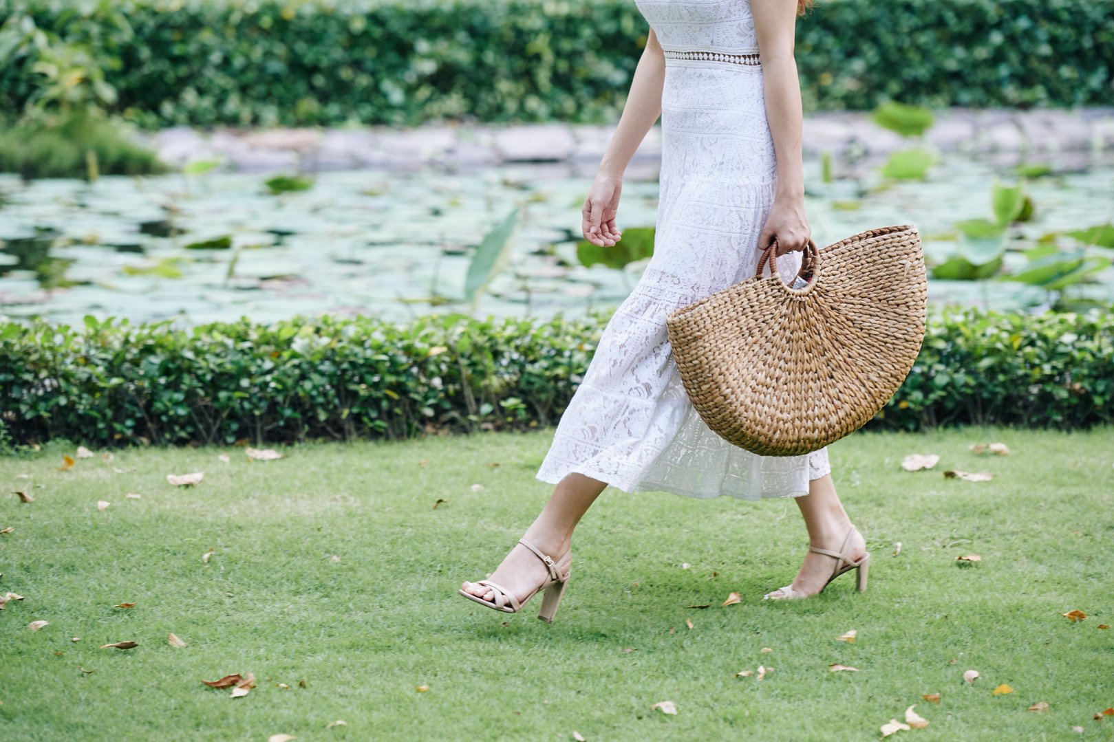 Walking Woman with Straw Bag