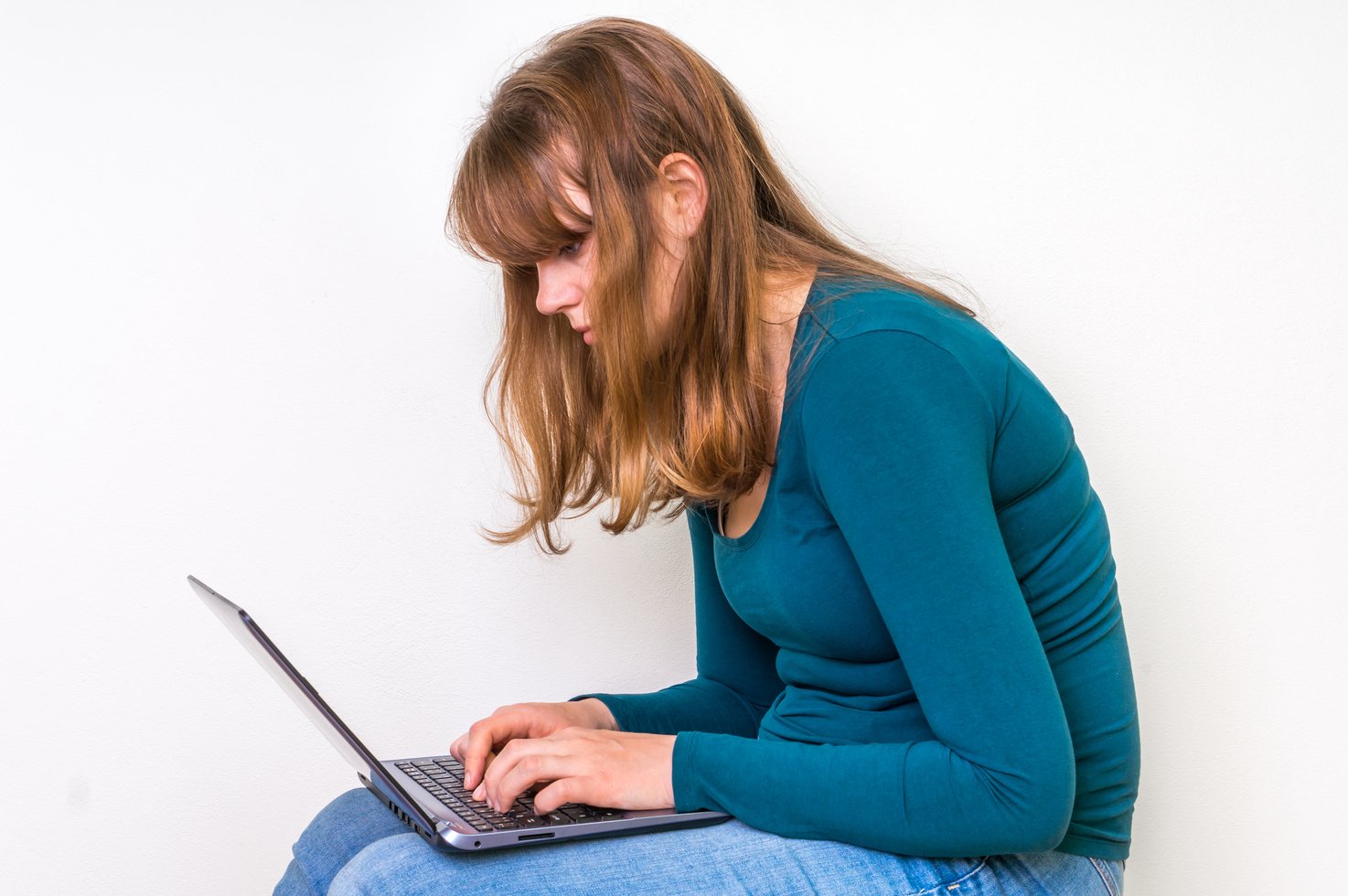 Woman is suffering from back pain - bad posture concept